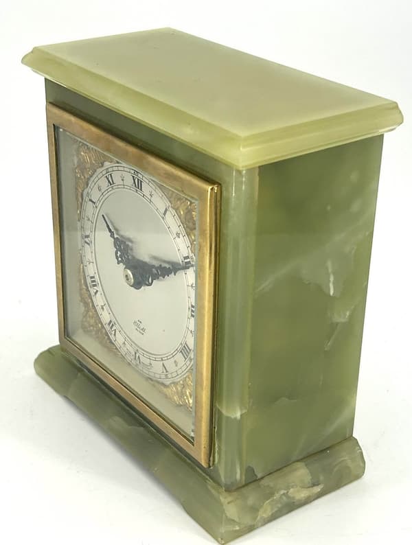 Stunning green onyx case Elliot and co 8 day mantel clock. Elliot silver metal dial with ormolu spandrels.