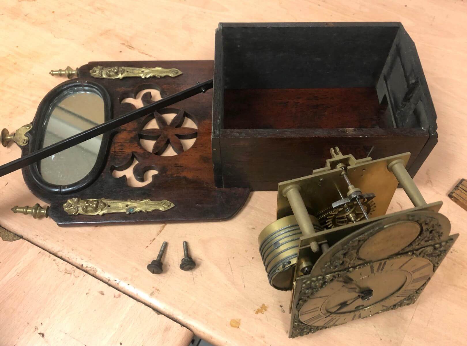 Clock movement being inspected at the Vintage Clocks workshop