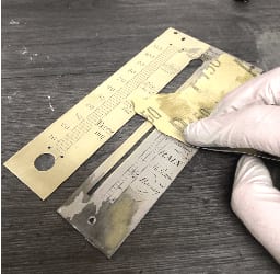 Antique clock dial restoration in progress at Vintage Clocks
