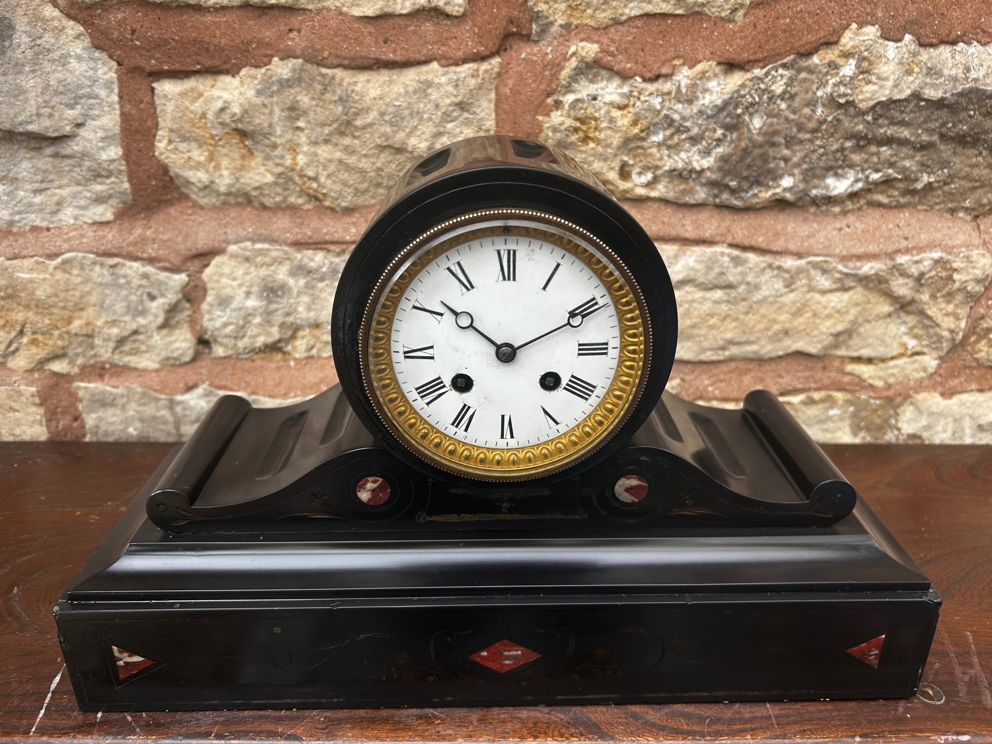 Marble inlay French made ca 1880 Original enamel dial and moon hands good working order Nicely made good quality clock Measures 25cm high, 39.5cm length, 14cm depth Very nicely made and well designed clock, very heavy stylish piece. It is decorated with inlaid marble. Still has its original enamel dial and moon hands with an ormolu bezel. All original and in good working order. This would make a lovely statement piece in a vintage inspired interior or on an office desk. Nice condition for age, showing slight signs of age in places. Please view the many photos to make sure you will be happy.