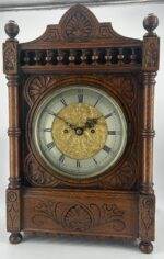 Victorian Carved oak bracket clock ca 1840. Wonderful original silver dial with a stunning ormolu detailed center piece, wonderful carved case with beautiful finials and bun feet all original to the period.