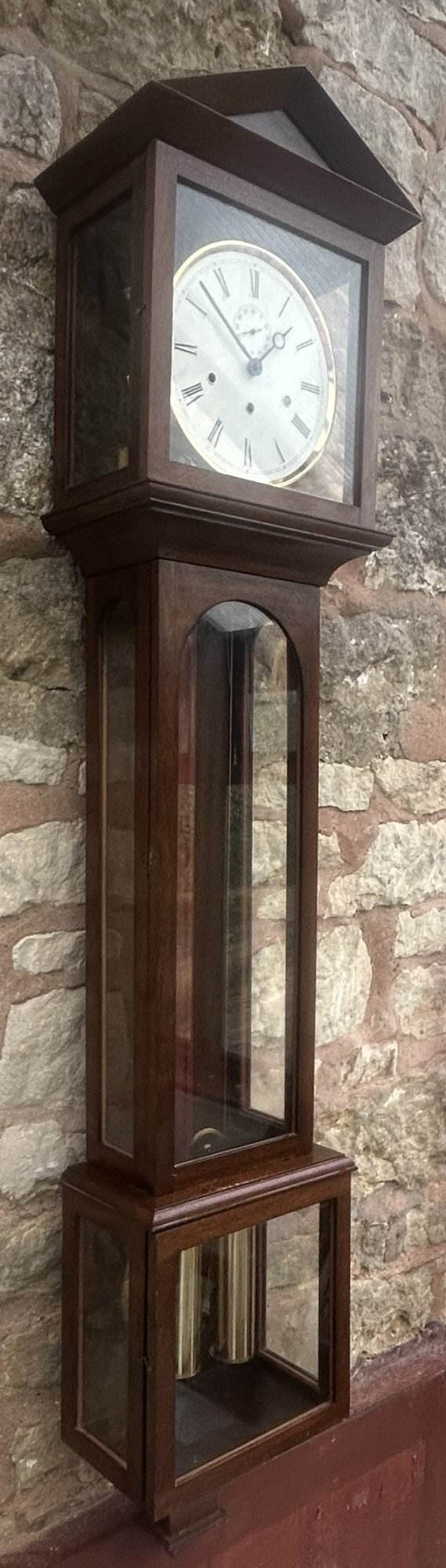 Lovely Musical Westminster chime wall clock ca 1970. Original dial and hands. Musical Westminster quarter striking movement. 9 glass panels, large pendulum making it very accurate.